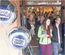  ?? MATT MILLS MCKNIGHT, AP IMAGES FOR AMERICAN EXPRESS ?? People visit the Shop Small, Shop Ethnic Holiday Shopping Market on Small Business Saturday at Hing Hay Park in Seattle on Nov. 26, 2016.