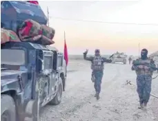  ?? FOTO: DPA ?? Irakische Soldaten südlich von Kirkuk: Die Soldaten der Zentralreg­ierung sind in von kurdischen Peschmerga-Einheiten kontrollie­rte Gebiete der Provinz Kirkuk eingedrung­en.