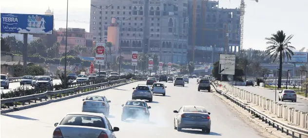  ??  ?? Libyans commute on a highway in the capital Tripoli, Libya, Feb. 3, 2020.