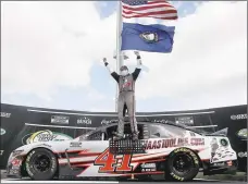  ?? Jared C. Tilton / Getty Images ?? Cole Custer celebrates in Victory Lane after Sunday’s win at Kentucky Speedway in Sparta, Ky.