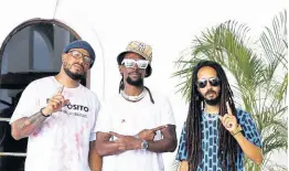  ??  ?? Panamanian entertaine­r Karims (left) and producer DJ Chiqui Dubs (right), recently visited the island, and on their to-do list was the completion of a project with Jah Cure.