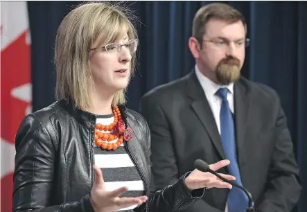  ?? ED KAISER ?? The Alberta Motor Vehicle Industry Council “is an organizati­on that perhaps fell off the tracks,” says Service Alberta Minister Stephanie McLean, left, here last year releasing a report commission­ed to review the council, along with the organizati­on’s...