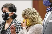  ?? MATTHEW DAE SMITH / LANSING STATE JOURNAL ?? Flanked by her attorneys, former Michigan State gymnastics coach Kathie Klages was sentenced to 90 days in jail Tuesday.