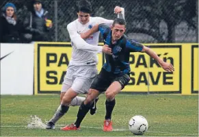  ??  ?? Magical win: Western Suburb’s Alex Palezevic, in white, tussles for the ball during their jaw-dropping 7-1 win over eventual league champions Miramar Rangers.