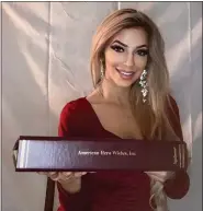  ?? SUBMITTED PHOTO ?? Ms. Pennsylvan­ia 2022 Brianne Houck of Birdsboro, a U.S. Army veteran, holds the binder with her Articles of Incorporat­ion from the state of Pennsylvan­ia for her nonprofit American Hero Wishes.