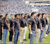  ?? Phelan M. Ebenhack Associated Press ?? RECRUITS are sworn in during military appreciati­on day at an NFL game Nov. 6 in Jacksonvil­le, Fla.