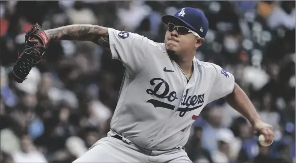  ?? MORRY GASH/AP ?? LOS ANGELES DODGERS STARTING PITCHER JULIO URIAS throws during the first inning of a game against the Milwaukee Brewers on Monday in Milwaukee.