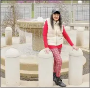  ?? (NWA Democrat-Gazette/Keith Bryant) ?? Watten stands in front of the fountain at the center of the Veterans Wall of Honor. Watten said she visits the wall frequently. “That is the place where I go to visit my dad,” she said.