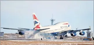  ?? [AP PHOTO] ?? A British Airways plane touches down at Denver Internatio­nal Airport.