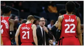  ?? (AP file photo) ?? Coach Nick Nurse (middle) and the Toronto Raptors have an NBA championsh­ip to defend, a long stay at the Disney complex in Orlando, Fla., awaiting them and plenty of unanswered questions on how the restart of the season will work.