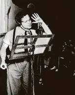  ??  ?? Orson Welles broadcasts his radio show of H.G. Wells’ science fiction novel “The War of the Worlds” in New York in 1938. It captured the imaginatio­n of the nation and has inspired present-day theater groups to reach out to audiences by radio in the time of social distancing.