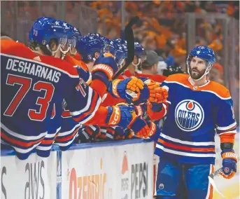  ?? CODIE MCLACHLAN/GETTY IMAGES ?? Burford's Adam Henrique celebrates a goal against the Los Angeles Kings during the first period in Game 1 of the 2024 Stanley Cup playoffs at Rogers Place on Monday in Edmonton. Henrique's goal helped lead the Oilers to a 7-4 win.