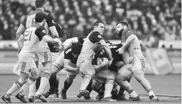  ??  ?? France’s flanker Louis Picamoles (third right) and France’s prop Rabah Slimani (first right) block Scotland’s number 8 Josh Strauss (second right) during the Six Nations internatio­nal rugby union match between France and Scotland at the Stade de France...