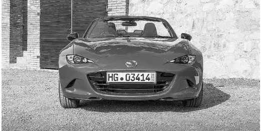  ??  ?? The designers of the new MX-5 have given this model an aggressive, serpentine face with the nose set low.