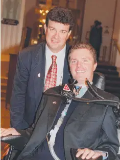  ??  ?? Perry with dad Brian after being named Young Queensland­er of the Year in 1997.