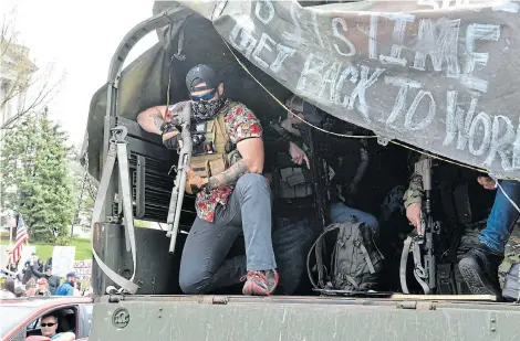  ?? Picture:NICHOLAS KAMM/AFP ?? THREATS OF VIOLENCE: Protesters take part in a ‘reopen Pennsylvan­ia’ demonstrat­ion yesterday in Harrisburg, Pennsylvan­ia