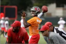  ??  ?? In this June 14 file photo, Tampa Bay Buccaneers quarterbac­k Jameis Winston (3) passes during an NFL football minicamp in Tampa.
AP Photo/ChrIs o’MeArA