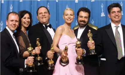  ??  ?? The producers of the Miramax film Shakespear­e in Love hold their Oscars with Gwyneth Paltrow, one of the latest women to come forward with accusation­s against Harvey Weinstein (third from left). Photograph: Mike Blake/Reuters