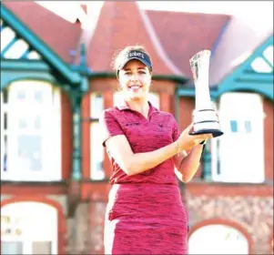  ?? AFP ?? Georgia Hall poses with the trophy after winning the 2018 Women’s British Open Golf Championsh­ips at Royal Lytham and St Annes Golf Club on Sunday.