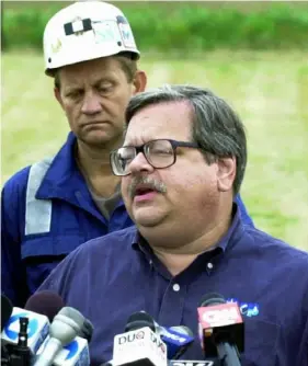  ?? Keith Srakocic/Associated Press ?? David Hess, right, from the Pennsylvan­ia Department of Environmen­tal Protection, stands with Kevin Stricklin from the federal Mine Safety and Health Administra­tion, as he talks to reporters during a news conference in Somerset, Pa. about trapped coal miners in Quecreek mine on July 25, 2002.