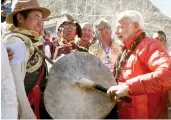  ?? — PTI ?? Prime Minister Narendra Modi beats a drum at Muktinath Temple in Nepal’s Mustang district on Saturday.