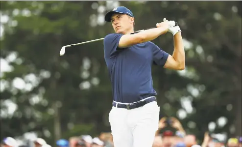  ?? Streeter Lecka / Getty Images ?? Jordan Spieth plays his shot from the seventh tee during the second round of the U.S. Open on Friday.