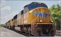  ?? THE ASSOCIATED PRESS ?? Railroads including Union Pacific Corp., Norfolk Southern Corp. and CSX Corp. are weighing offering paid sick days — or are already doing so — along with schedule changes and other steps to improve employees’ work-life balance and aid hiring and retention. This Union Pacific train is shown traveling through Union, Neb.