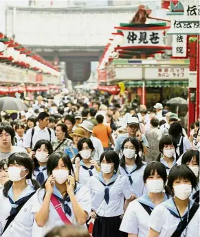  ??  ?? Mask appeal: Some in Japan wear masks to shield themselves against social situations that trigger anxiety.