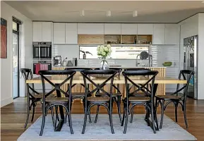  ??  ?? Natural light floods the open-plan living and dining areas.