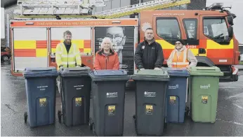  ?? ?? From left, Paul O’Neil, Cllr Linda Green, Steven Bewick, Cllr Louise Farthing and the bins with warning stickers