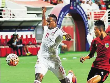  ?? Abdul Rahman/Gulf News ?? Scoring machine Ahmad Khalil of UAE in action against East Timor during the Asian qualifier for the 2018 Fifa World Cup in Abu Dhabi. The striker has been in supreme form recently.