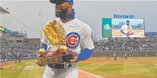  ?? AP ?? Though he struggled with the bat, Cubs right fielder Jason Heyward was rewarded for his defense again. He was presented with his fifth Gold Glove on Wednesday.