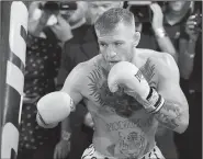  ?? AP/JOHN LOCHER ?? Conor McGregor continues to stand by his prediction that he will knock out Floyd Mayweather Jr. on Saturday night. “I’m starting to think I’ll toy with him once he goes down,” McGregor said.