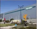  ?? ASSOCIATED PRESS FILE PHOTO ?? Trucks drive in front of Teva Pharmaceut­ical Logistic Center in the town of Shoam, Israel, Oct. 16, 2013.