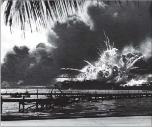 ?? National Archives
/ Getty Images /TNS ?? The USS Shaw explodes during the Japanese raid on Pearl Harbor, Dec. 7, 1941.