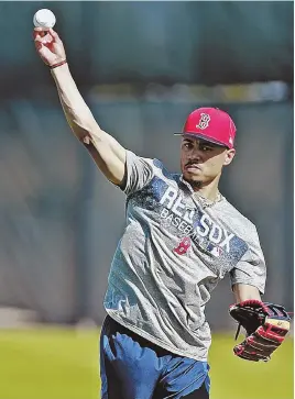  ?? STAFF PHOTO BY MATT STONE ?? LET IT GO: Mookie Betts unloads during yesterday’s workout.