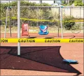  ?? Jarrod Valliere San Diego Union-Tribune ?? PLAYGROUND EQUIPMENT is wrapped in caution tape in Vista, Calif., in 2020.