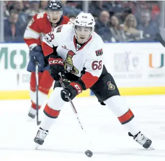  ?? WILFREDO LEE/THE ASSOCIATED PRESS FILES ?? Ottawa Senators’ left wing Mike Hoffman takes a shot as he is pursued by Florida Panthers left wing Jussi Jokinen during the first period of an NHL hockey game, Tuesday, Jan. 31, 2017, in Sunrise, Fla.