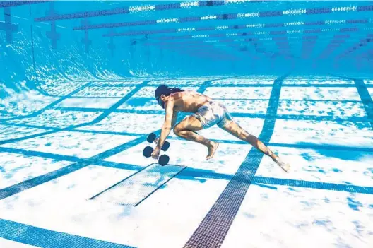  ?? GROUNDWORK PROMOTIONS ?? Fernando Tatis Jr. walks across the bottom of a La Jolla pool while carrying weights, part of his offseason training program alongside pitcher Joe Musgrove.