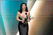  ?? CHRIS PIZZELLO / INVISION ?? Jacqueline MacIness Wood accepts the award for outstandin­g performanc­e by a lead actress in a daytime drama series for “The Bold and the Beautiful” during the 50th Daytime Emmy Awards on Friday at the Westin Bonaventur­e Hotel in Los Angeles.