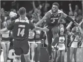  ?? The Los Angeles Times/tns ?? UC Irvine’s Evan Leonard high fives Max Hazzard after the Anteaters iced the game against Kansas State on Friday in San Jose.