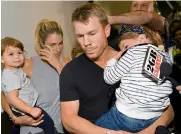  ??  ?? DAVID WARNER LOOKS TEARY- EYED, WHILE HIS WIFE CANDICE BROKE DOWN AT THE AIRPORT