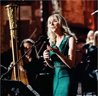  ?? ?? MUSICAL TREAT: Muireann Nic Amhlaoibh performing in St Canice’s Cathedral, Kilkenny