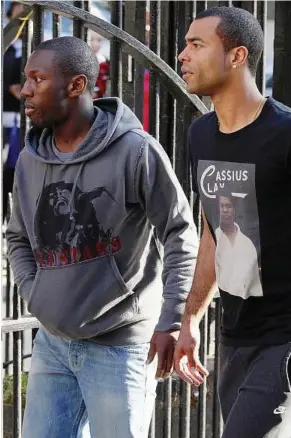  ?? — AFP ?? Good news: Chelsea defender Ashley Cole (right) arriving with QPR’S Shaun Wright-phillips at the London Chest Hospital on Monday. Fabrice Muamba is being treated at the hospital after suffering a cardiac arrest during an FA Cup quarterfin­al match...