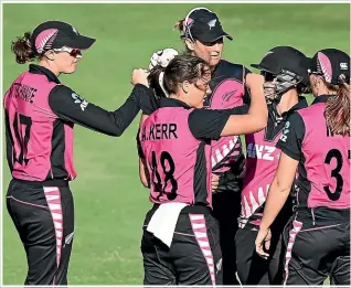  ??  ?? The pink White Ferns uniform of today is vastly different to what women wore in the early years of cricket in New Zealand.