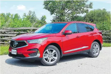  ?? BRIAN HARPER ?? The darkish grey finish makes the wheels on the Acura RDX look permanentl­y dirty and coated in brake dust.