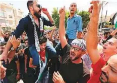  ?? Reuters ?? Protesters chant slogans during a demonstrat­ion near the Israeli embassy in Amman, Jordan, yesterday