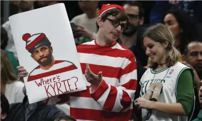  ?? Photograph: Michael Dwyer/AP ?? Signs mocking Kyrie Irving were in abundance in Boston on Wednesday.
