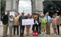  ??  ?? Officials gather at the National Memorial Arch for a presentati­on of the check for $54,000, whch was raised during last year’s Rev Run.