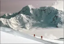  ?? The Canadian Press ?? Lisel Currie and Carl Nagy ski roped together on King Trench route of Mount Logan, at Kluane National Park, Yukon.